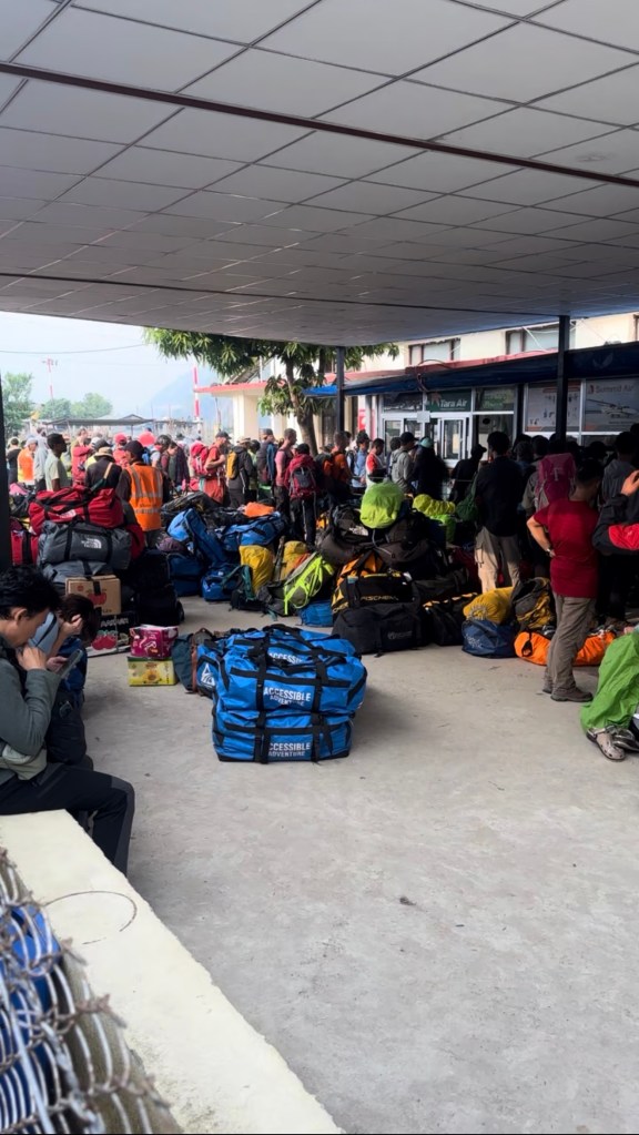Trekkers and luggage waiting at Ramechhap Airport in Manthali for flights to Lukla Nepal